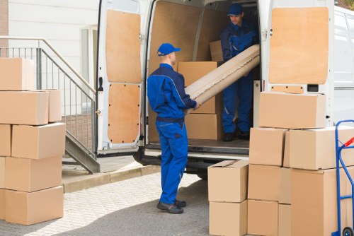 Students moving boxes during a removal service in Walthamstow