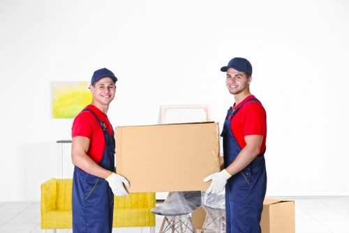 Packed moving boxes and furniture ready for house removals in Walthamstow