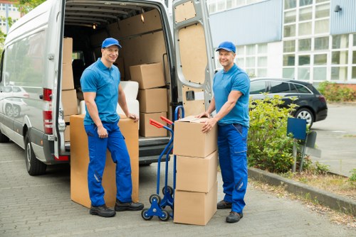 Removal team loading furniture for a local move in East London