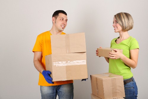 Furniture and boxes being loaded into a removal van